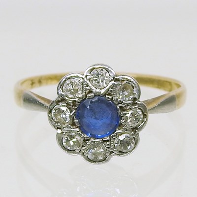 Lot 434 - An 18 carat gold, sapphire and diamond cluster...