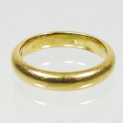 Lot 227 - A 22 carat gold wedding band, of plain design,...