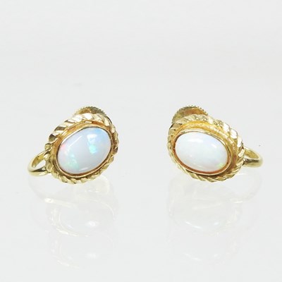 Lot 122 - A pair of 15 carat gold, opal earrings, each...