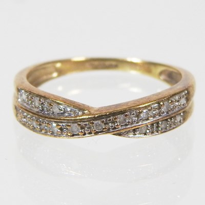 Lot 166 - A 9 carat gold and diamond set ring, of...