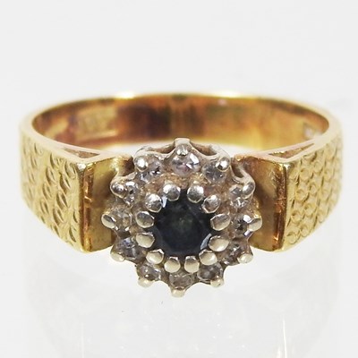 Lot 72 - An 18 carat gold, sapphire and diamond cluster...