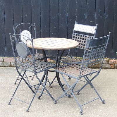 Lot 461 - A tile top garden table, together with four...