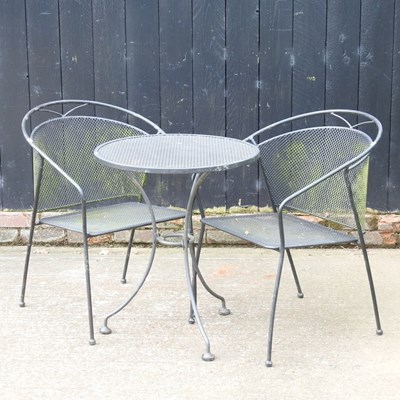 Lot 450 - A metal garden table, together with a pair of...