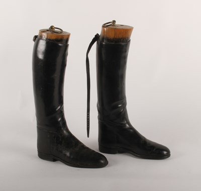 Lot 335 - A pair of black leather riding boots and trees,...