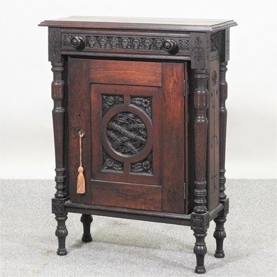 Lot 264 - A 17th century style carved oak cabinet