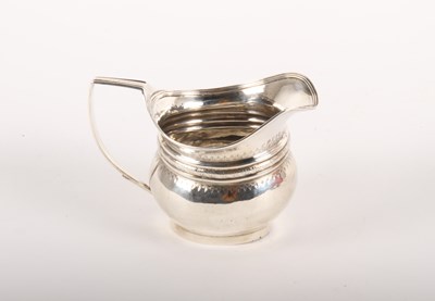 Lot 185 - A silver bright cut cream jug, London 1804, 113g