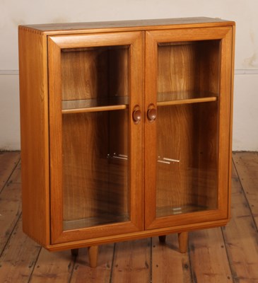 Lot 32 - An Ercol blonde elm Windsor glazed display...