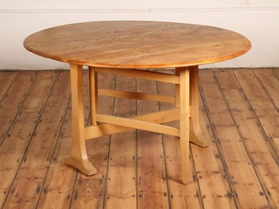 Lot 67 - An Ercol blonde elm Windsor drop leaf dining...