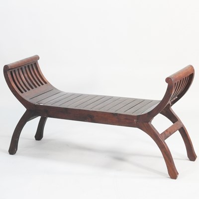 Lot 19 - A hardwood window seat, on splayed legs