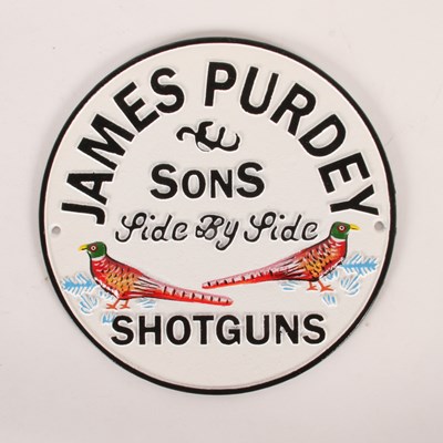 Lot 322 - A painted cast iron James Purdey shotguns...