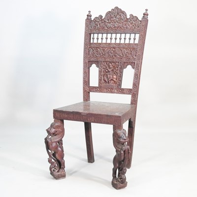 Lot 281 - A large Burmese carved hardwood side chair,...