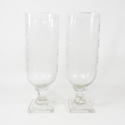 Lot 462 - A pair of glass storm vases, each having star...