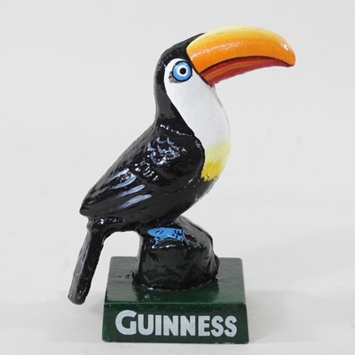Lot 132 - A modern painted metal Guinness toucan, 15cm high
