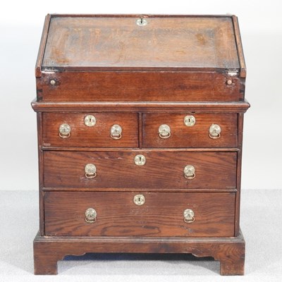 Lot 339 - An 18th century oak bureau, of small...