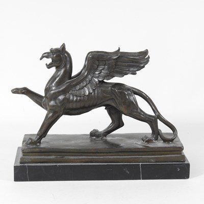 Lot 199 - A bronze model of a Griffin, on a marble...
