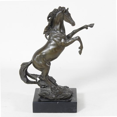 Lot 13 - A bronze statue of a rearing horse, on a...