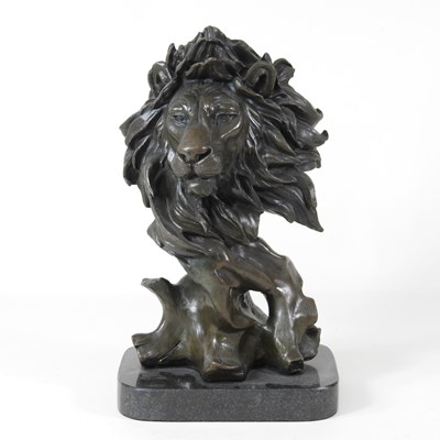 Lot 52 - A bronze statue of a lion mask, on a marble...