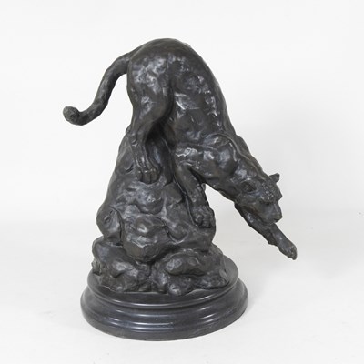 Lot 24 - A bronze statue of a jaguar, on a rock, on a...