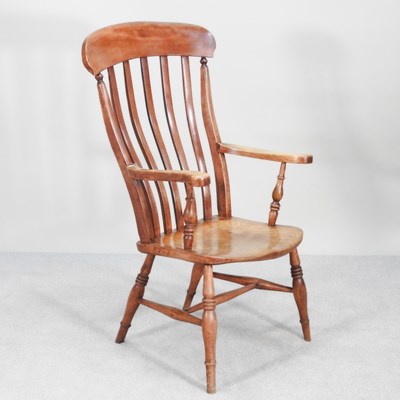 Lot 369 - A 19th century elm seated splat back armchair,...