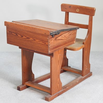 Lot 521 - An early 20th century pitch pine school desk,...