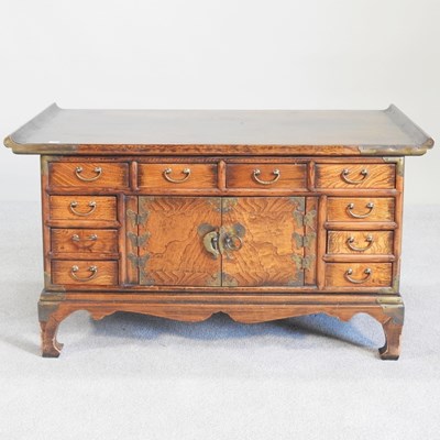 Lot 116 - A Chinese oak occasional table, containing...