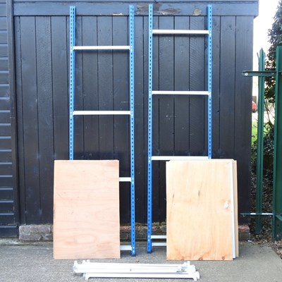 Lot 300 - A blue shelving unit, 242cm high, together...