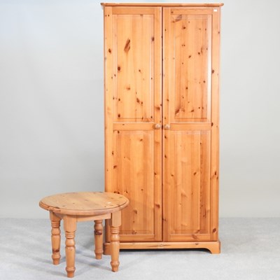 Lot 283 - A modern pine double wardrobe, together with...