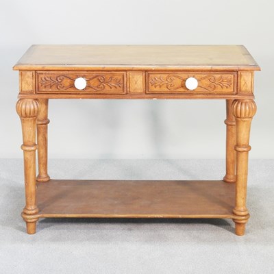 Lot 166 - An antique carved pine side table, with an...