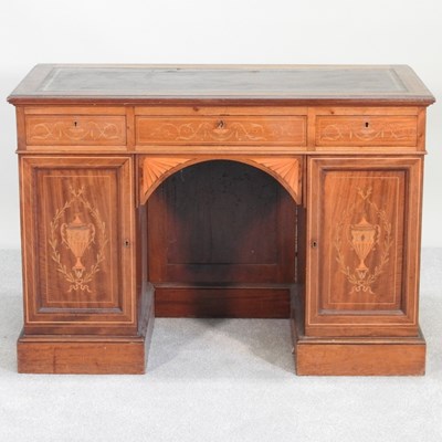 Lot 271 - An Edwardian marquetry kneehole desk, with an...