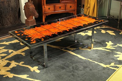Lot 3 - A 1970’s chrome coffee table, having a black...