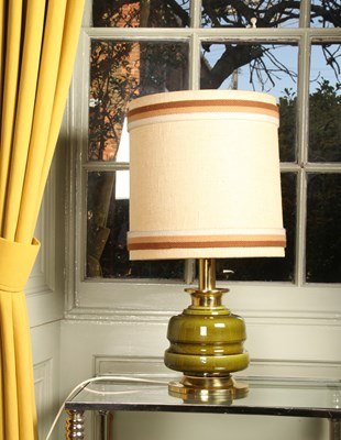 Lot 17 - A brass and green glazed pottery table lamp,...