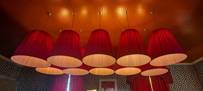 Lot 39 - A pair of large red pleated light shades