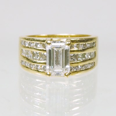Lot 516 - An 18 carat gold and diamond ring, with a...