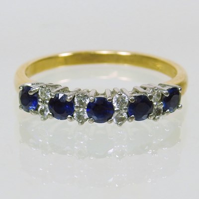 Lot 303 - An 18 carat gold sapphire and diamond half...