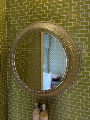 Lot 138 - A clear moulded circular wall mirror