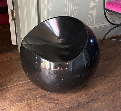 Lot 173 - A black painted fibreglass globular stool