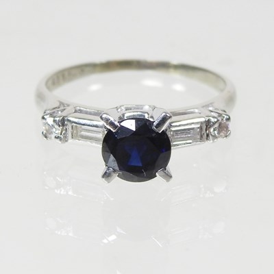 Lot 124 - An 18 carat white gold, sapphire and diamond...
