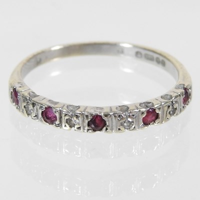 Lot 159 - A 9 carat gold ruby and diamond half hoop...