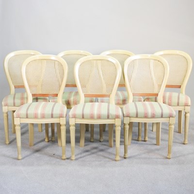 Lot 130 - A set of French cream painted dining chairs,...