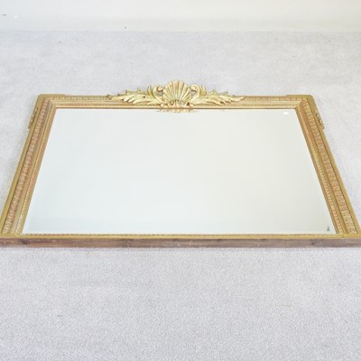 Lot 275 - A gilt over mantel mirror, with a shell...