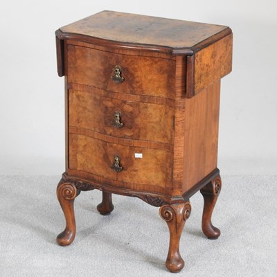 Lot 222 - An early 20th century walnut drop leaf bedside...