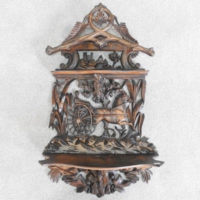 Lot 294 - A late 19th century Swiss carved walnut wall...
