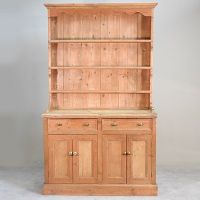 Lot 296 - An antique pine dresser, with a boarded back,...