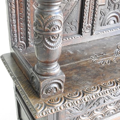 Lot 56 - A 17th century style heavily carved oak court...