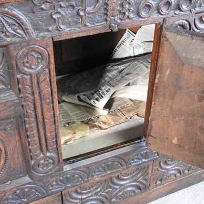 Lot 56 - A 17th century style heavily carved oak court...