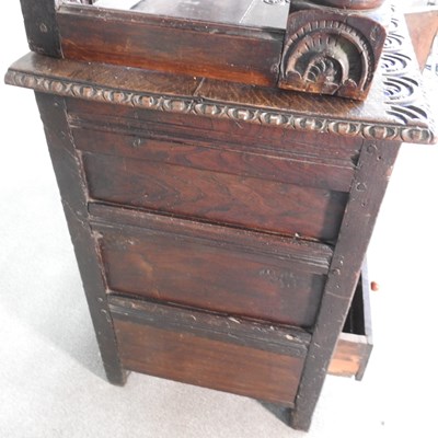 Lot 56 - A 17th century style heavily carved oak court...