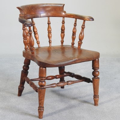 Lot 122 - An early 20th century smoker's bow armchair