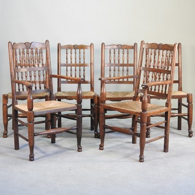 Lot 585 - A set of six spindle back rush seated dining...