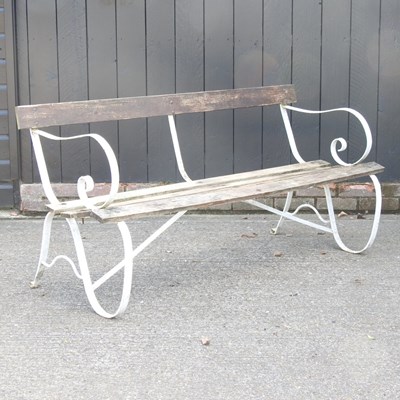 Lot 145 - A wooden garden bench, on white painted iron...
