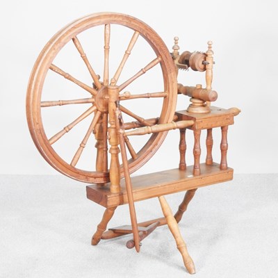 Lot 397 - A Norwegian pine spinning wheel, mid 20th...
